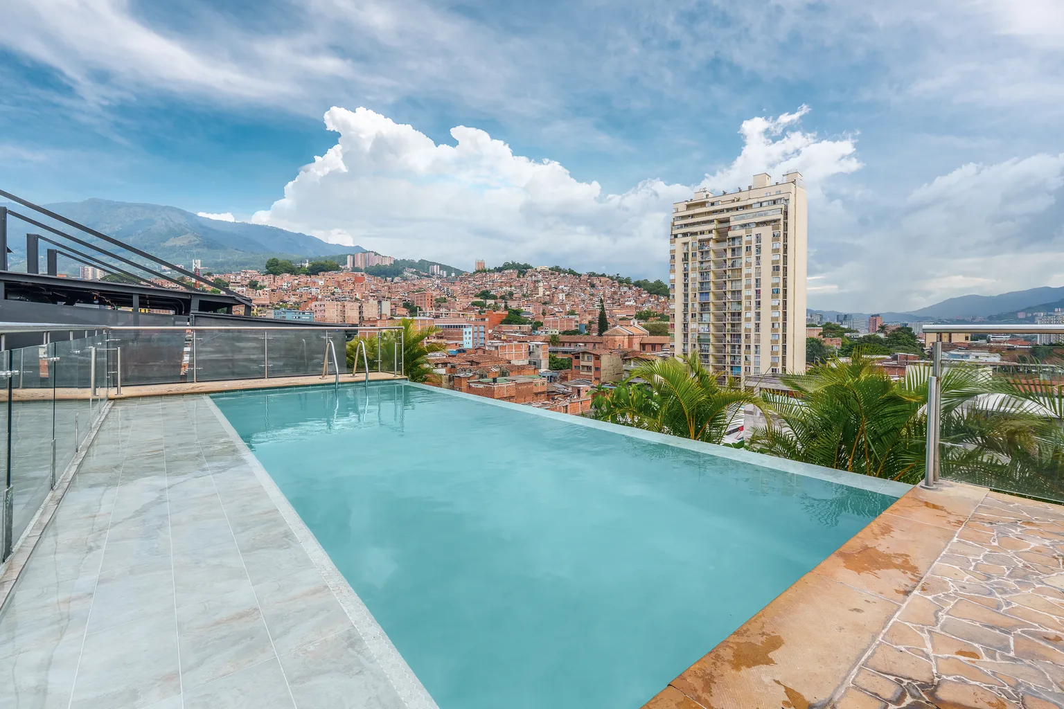 Rooftop pool at Appartments Hotel overlooking downtown Medellín
